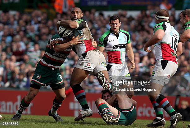 Jordan Turner-Hall of Harlequins is tackeld during the Guinness Premiership match between Leicester Tigers and Harlequins at Welford Road on April...
