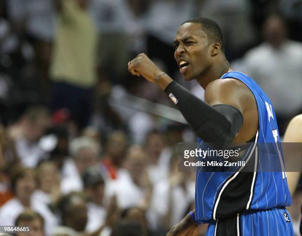 Center Dwight Howard argues with a referee and receives a technical foul during the game between the Charlotte Bobcats and the Orlando Magic in Game...