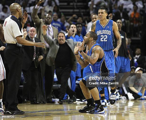 Guard Jameer Nelson of the Orlando Magic pleads with referee Leon Wood after he made a three point shot during the game between the Charlotte Bobcats...