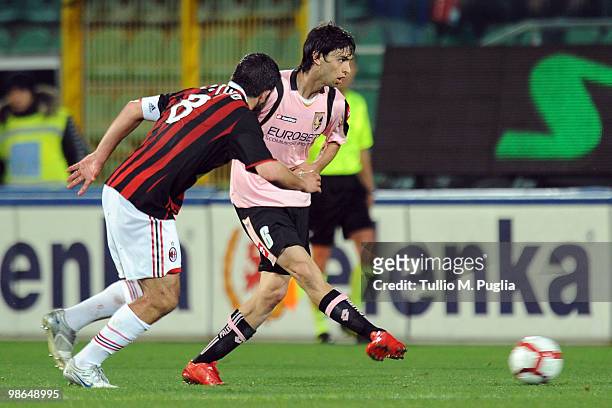Gennaro Gattuso of Milan and and Javier Pastore of Palermo compete for the ball during the Serie A match between US Citta di Palermo and AC Milan at...