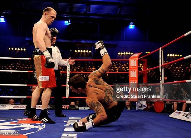 Juergen Braehmer of Germany knocks down Mariano Nicolas Plotinsky of Argentina during their WBO light heavyweight fight during the Universum...