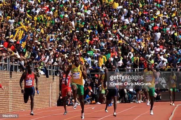 Usain Bolt of Jamaica Gold heads for the finish line the USA versus The World 4 x 100-meter relay during the Penn Relays at Franklin Field April 24,...