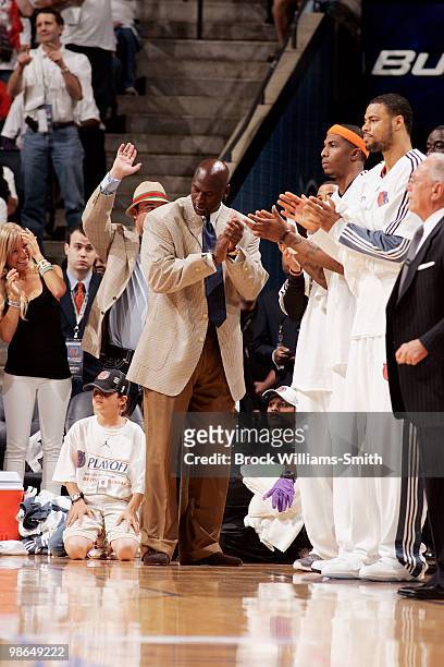 Michael Jordan applauds the Charlotte Bobcats in the game against the Orlando Magic in Game Three of the Eastern Conference Quarterfinals during the...