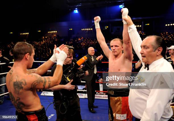 Juergen Braehmer of Germany is declared the winner after his WBO light heavyweight fight with Mariano Nicolas Plotinsky of Argentina during the...