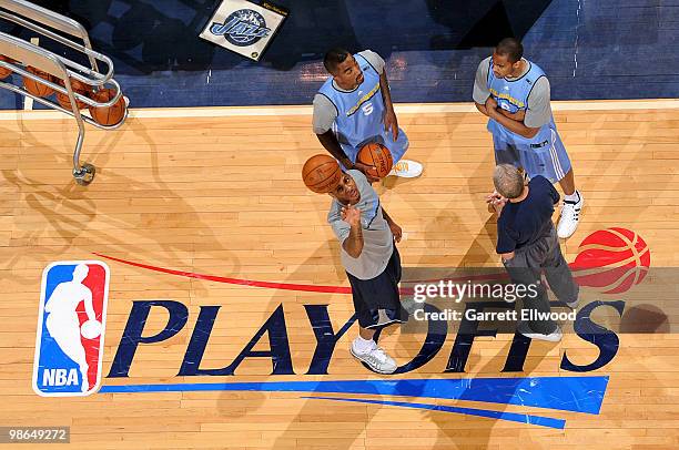 Assistant coach Tim Grgurich talks with J.R. Smith, Carmelo Anthony and Arron Afflalo of the Denver Nuggets during practice prior to Game Four of the...