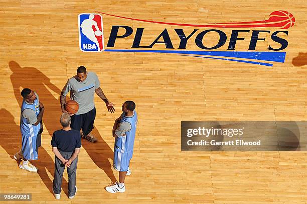 Assistant coach Tim Grgurich talks with J.R. Smith, Carmelo Anthony and Arron Afflalo of the Denver Nuggets during practice prior to Game Four of the...