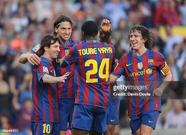Lionel Messi , Zlatan Ibrahimovic Toure Yaya and Carles Puyol of Barcelona celebrate after Ibrahimovic scored his team's third goal during the La...
