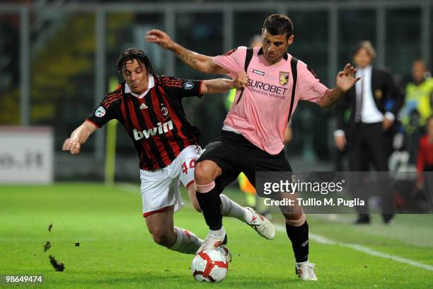Massimo Oddo of Milan and Antonio Nocerino of Palermo compete for the ball during the Serie A match between US Citta di Palermo and AC Milan at...