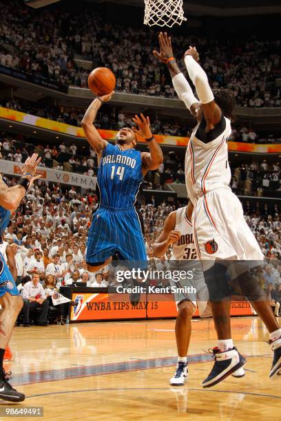 Jameer Nelson of the Orlando Magic goes for the layup against Gerald Wallace of the Charlotte Bobcats in Game Three of the Eastern Conference...