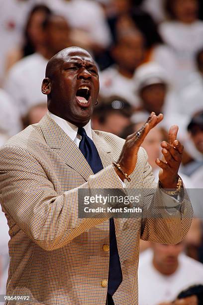 Michael Jordan cheers for the Charlotte Bobcats in the game against the Orlando Magic in Game Three of the Eastern Conference Quarterfinals during...