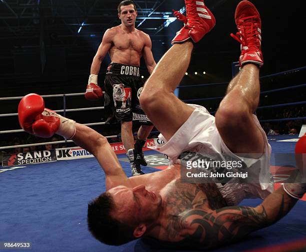 Carl Froch of England knocks down Mikkel Kessler of Denmark during their Super Six WBC Super Middleweight title fight on April 24, 2010 at MCH...