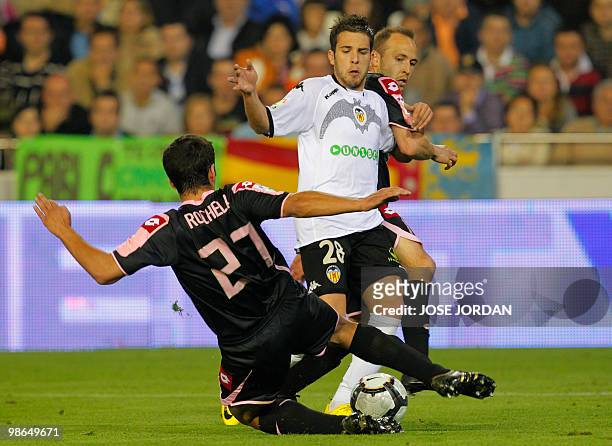 Valencia's midfielder Jordi Alba vies for the ball with Deportivo's David Rochela during their Spanish league football match at Mestalla stadium on...