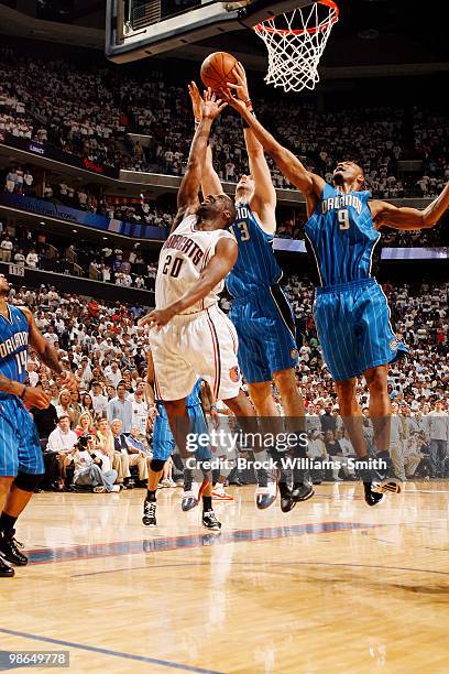 Raymond Felton of the Charlotte Bobcats blocks against Rashard Lewis of the Orlando Magic in Game Three of the Eastern Conference Quarterfinals...