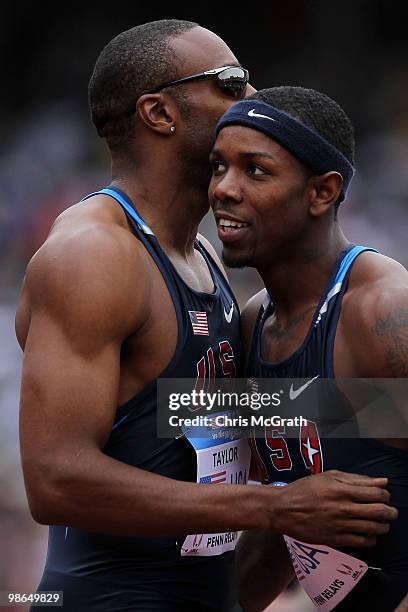 Angelo Taylor of USA Blue celebrates with team mate Bershawn Jackson after winning the USA vs The World Men's 4 x 400-meter relay during the Penn...