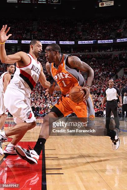 Amar'e Stoudemire of the Phoenix Suns drives against Juwan Howard of the Portland Trail Blazers in Game Four of the Western Conference Quarterfinals...