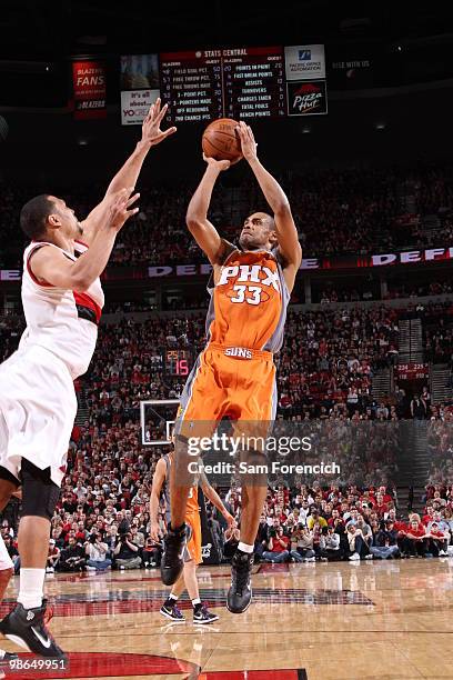 Grant Hill of the Phoenix Suns goes up for a shot over Brandon Roy of the Portland Trail Blazers in Game Four of the Western Conference Quarterfinals...