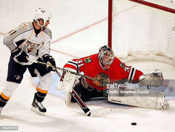 Antti Niemi of the Chicago Blackhawks turns away a shot by David Legwand the Nashville Predators in Game Five of the Western Conference Quarterfinals...