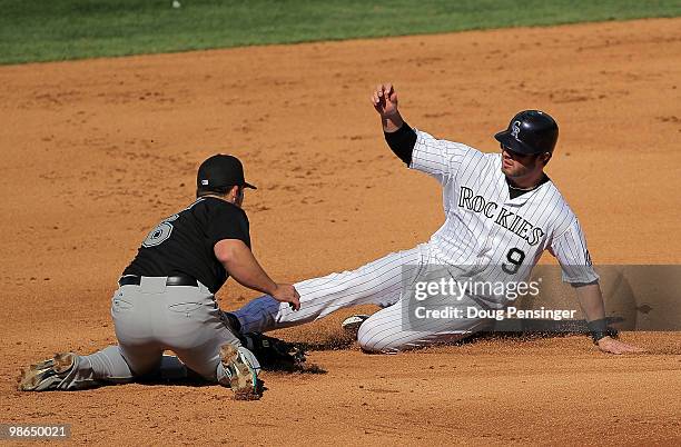 Second baseman Dan Uggla of the Florida Marlins tags out Ian Stewart of the Colorado Rockies as he attempts to steal second base at Coors Field on...