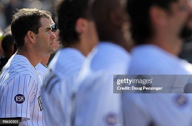 Seth Smith and the Colorado Rockies observe a moment of silence in the stadium in honor Keli McGregor prior to facing the Florida Marlins at Coors...