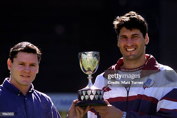 Matthew Burke captain of the NSW Waratahs and John Eales captain of the QLD Reds with the Templeton Cup which they will play for on Saturday night...