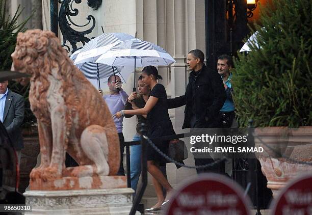 President Barack Obama and First Lady Michelle Obama leaves the Biltmore Estate after a tour in Asheville, North Carolina, on April 24, 2010. The...