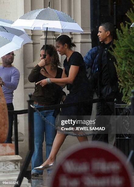 President Barack Obama and First Lady Michelle Obama leaves the Biltmore Estate after a tour in Asheville, North Carolina, on April 24, 2010. The...