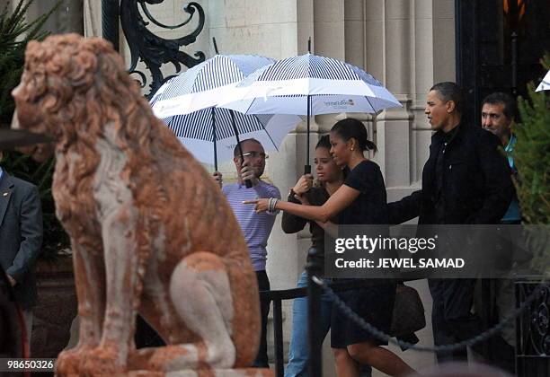 President Barack Obama and First Lady Michelle Obama leave the Biltmore Estate after a tour in Asheville, North Carolina, on April 24, 2010. The...