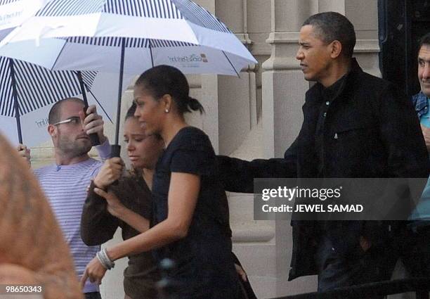 President Barack Obama and First Lady Michelle Obama leave the Biltmore Estate after a tour in Asheville, North Carolina, on April 24, 2010. The...