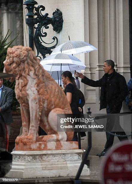 President Barack Obama and First Lady Michelle Obama leave the Biltmore Estate after a tour in Asheville, North Carolina, on April 24, 2010. The...