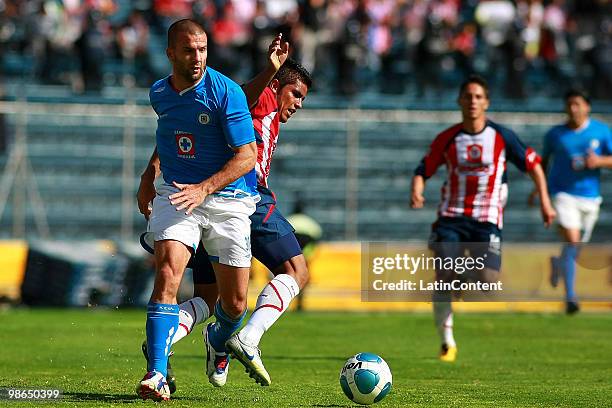 Cruz Azul's Emanuel Villa vies for the ball with Miguel Angel Ponce of Chivas Guadalajara during a 2010 Bicentenary Mexican championship soccer match...