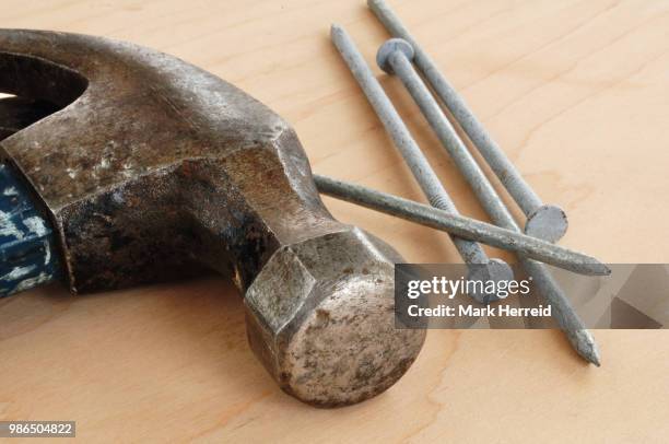 galvanized nails and a claw hammer - claw mark stock pictures, royalty-free photos & images