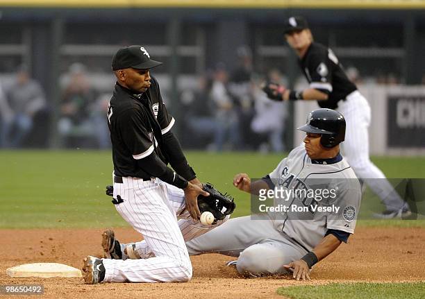 Alexei Ramirez of the Chicago White Sox can't catch the ball as Jose Lopez of the Seattle Mariners steals second base on April 24, 2010 at U.S....