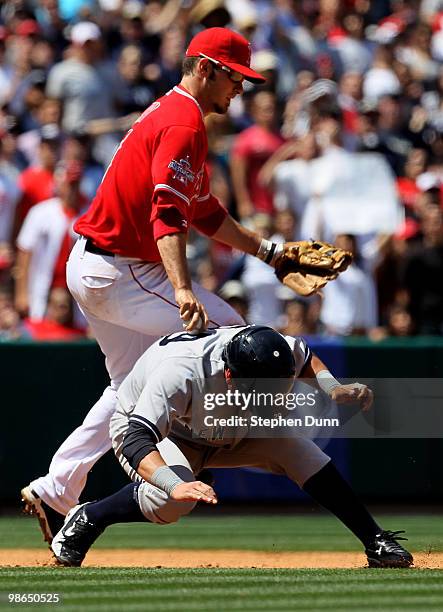 Third baseman Brandon Wood#3 of the Los Angeles Angels of Anaheim tags out Francisco Cervelli of the New York Yankees in a rundown in the fourth...