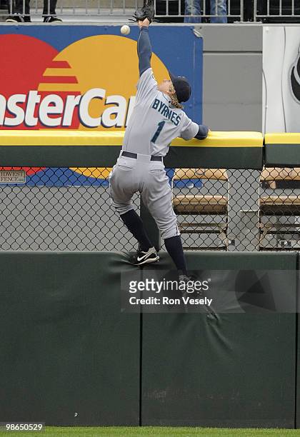 Eric Byrnes of the Seattle Mariners leaps but cannot catch the ball hit by Alexei Ramirez of the Chicago White Sox during the fifth inning on April...