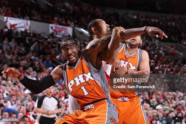 Amar'e Stoudemire of the Phoenix Suns hooks arms with Juwan Howard of the Portland Trail Blazers in Game Four of the Western Conference Quarterfinals...