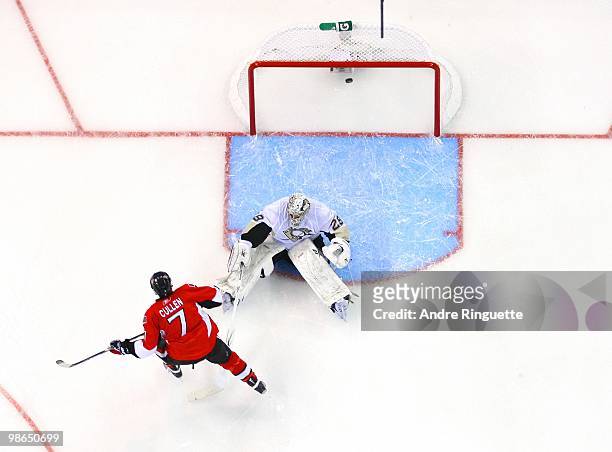 Matt Cullen of the Ottawa Senators shoots the puck in the back of the net behind Marc-Andre Fleury of the Pittsburgh Penguins for a first period goal...