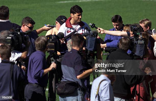 John Eales captain of the QLD Reds and Matthew Burke captain of the NSW Waratahs, at a press conference at the Sydney Football Stadium where they...