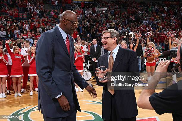 Legend Bob Lanier presents General Manager John Hammond of the Milwaukee Bucks with the 2009-10 NBA Executive of the Year award prior to Game Three...