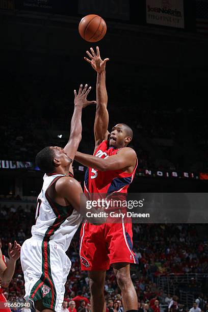 Al Horford of the Atlanta Hawks shoots a hook shot against Kurt Thomas of the Milwaukee Bucks in Game Three of the Eastern Conference Quarterfinals...