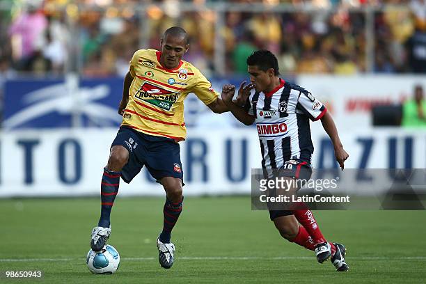 Morelia's Aldo Leao vies for the ball with Osvaldo Martinez of Monterrey during a 2010 Bicentenary Mexican championship soccer match between Monarcas...