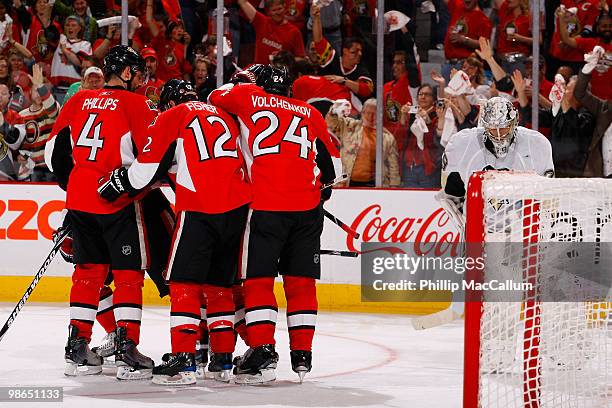 Daniel Alfredsson of the Ottawa Senators celebrates his goal with teammates Chris Phillips;Mike Fisher and Anton Volchenkov while Marc-Andre Fleury...