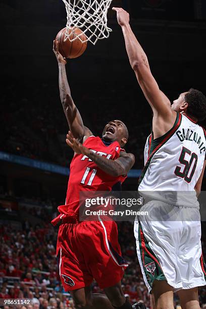 Jamal Crawford of the Atlanta Hawks shoots a layup against Dan Gadzuric of the Milwaukee Bucks in Game Three of the Eastern Conference Quarterfinals...