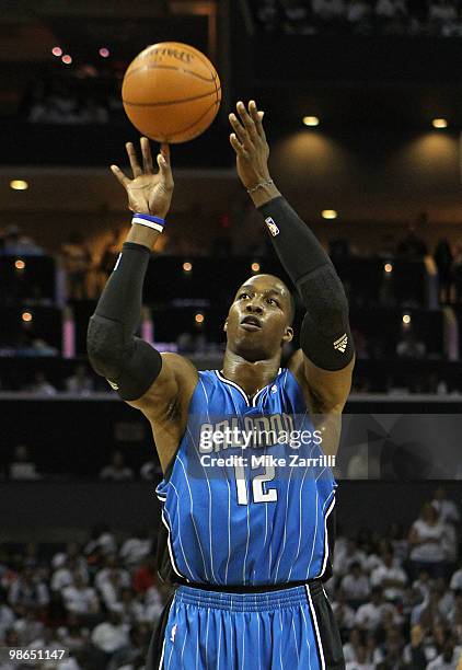 Center Dwight Howard of the Orlando Magic shoots a free throw during Game Three of the Eastern Conference Quarterfinals during the 2010 NBA Playoffs...