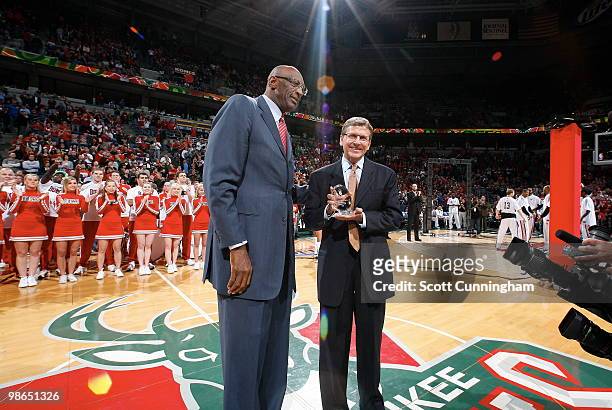General Manager John Hammond of the Milwaukee Bucks is awarded the NBA Executive of the Year by Bob Lanier before the game against the Atlanta Hawks...