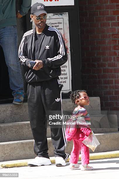 Chris Rock and a young girl are seen in a car park in the SOHO neighborhood on April 24, 2010 in New York City.