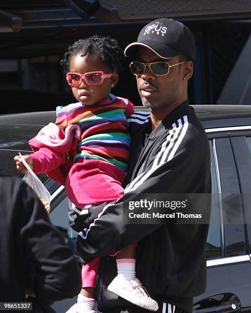 Chris Rock and a young girl are seen in a car park in the SOHO neighborhood on April 24, 2010 in New York City.