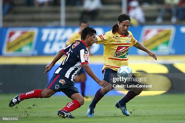 Morelia's Hugo Droguett vies for the ball with Osvaldo Martinez of Monterrey during a 2010 Bicentenary Mexican championship soccer match between...