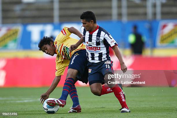 Morelia's Jorge Gastelum vies for the ball with Osvaldo Martinez of Monterrey during a 2010 Bicentenary Mexican championship soccer match between...
