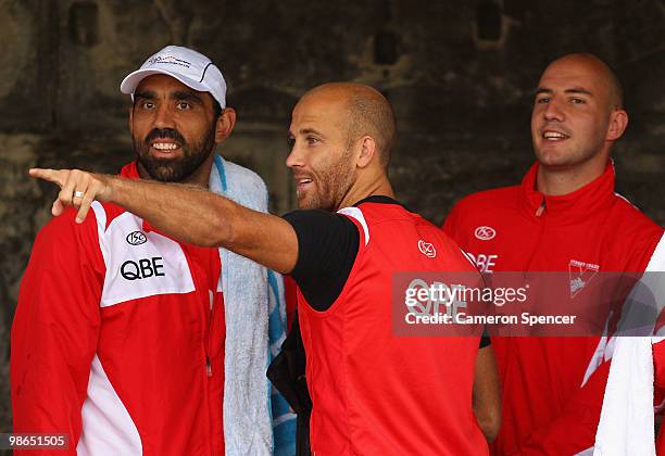 Jarrad McVeigh of the Swans points something out to team mates Adam Goodes and Tadhg Kennelly during a Sydney Swans AFL recovery session at Coogee...