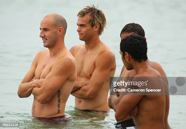 Tadhg Kennelly of the Swans and team mates wade in the ocean during a Sydney Swans AFL recovery session at Coogee Beach on April 25, 2010 in Sydney,...